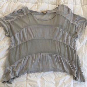 Cotton short-sleeved, partly-sheer, shirt.